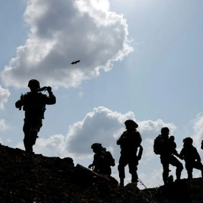 Israeli soldiers gather after the alert of an apparent security incident