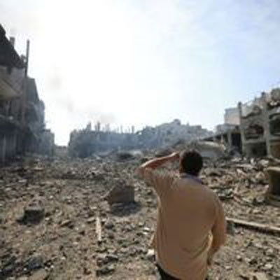 Man looking at the aftermath of a bombing