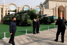 Posing with nuclear missiles in Beijing