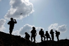 Israeli soldiers gather after the alert of an apparent security incident